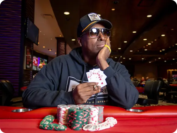 Maurice Hawkins at the poker table with his tournament winnings